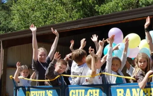 a group of people holding balloons