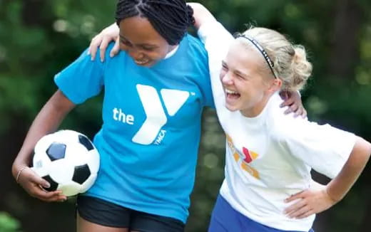 a couple of women playing football