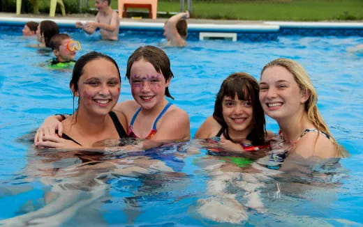 a group of people in a pool