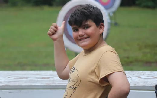 a boy holding a frisbee