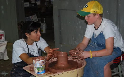 a woman and a man painting