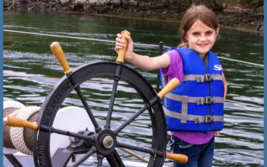 a girl holding a fishing rod and a fishing pole