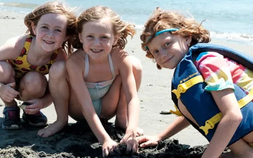 a group of children on a beach
