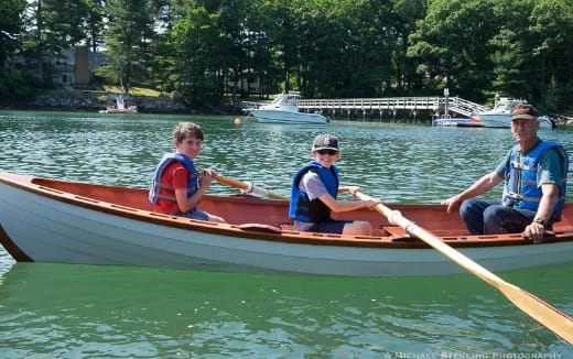 a group of people in a canoe