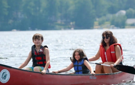 a group of people in a canoe