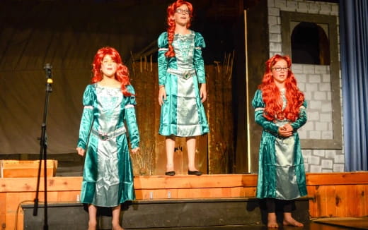 a group of women on a stage