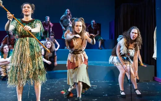 a group of women performing on stage