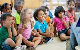 a group of children sitting on the floor