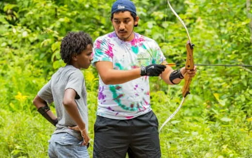 a person and a boy fishing