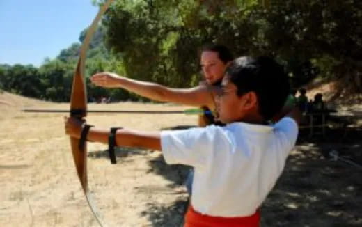 a man holding a bow and arrow