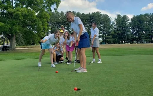 a group of people playing golf