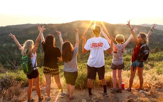 a group of people jumping in the air