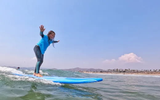 a person surfing on the waves