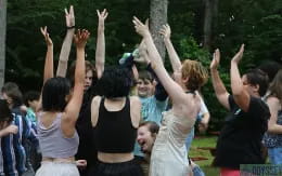 a group of people raising their hands