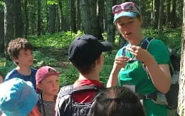 a group of people in the woods