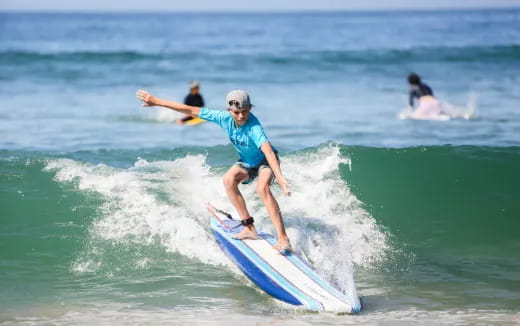 a person surfing on the waves