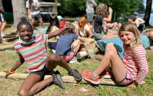 a group of children sitting on the ground