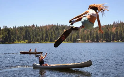 a man doing a flip on a surfboard