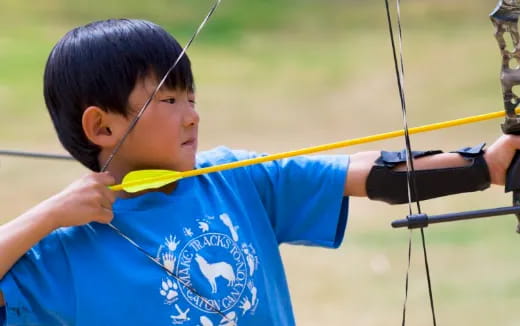 a boy holding a bow