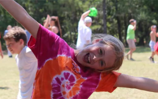 a girl with her arms up