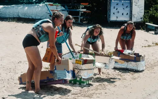 a group of women playing with boxes