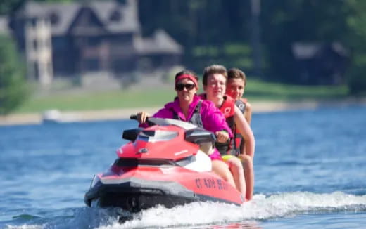a group of people riding a jet ski