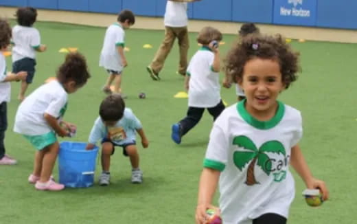 a group of kids playing football