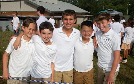 a group of men in white shirts