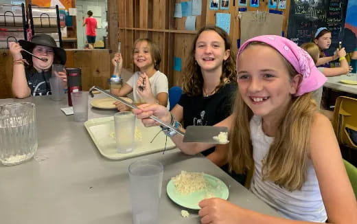 a group of people eating at a table