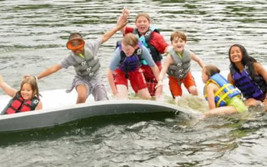 a group of people on a raft