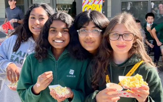 a group of women holding food