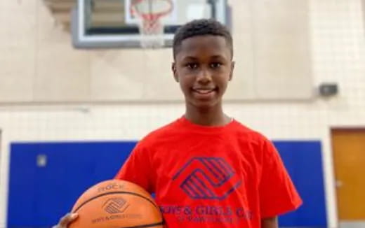 a person holding a basketball