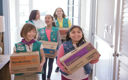 a group of girls holding signs