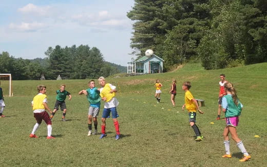 a group of kids playing football