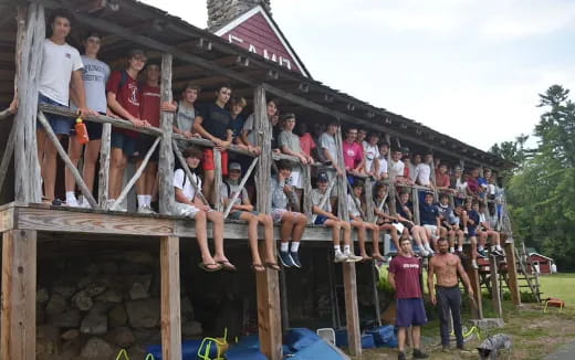 a group of people on a wooden structure