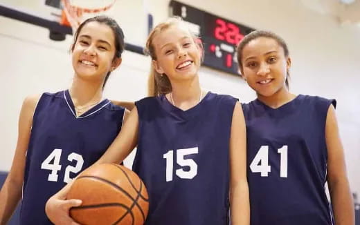 a group of women in basketball uniforms