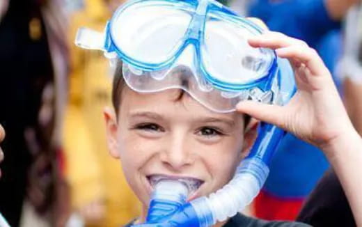a young boy wearing goggles