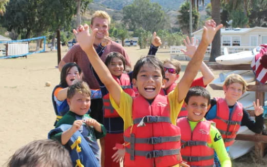 a group of people in life vests