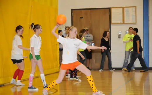 a group of girls playing basketball