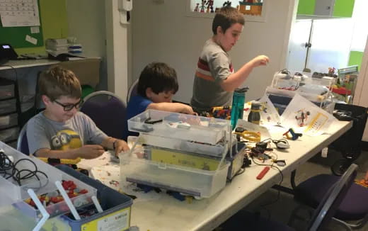 a group of boys working on a project