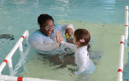 a person and a child in the water