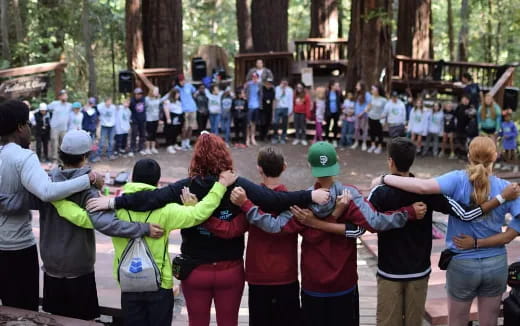 a group of people holding hands