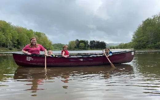 a group of people in a canoe