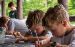 a few young boys studying