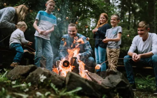 a group of people around a fire