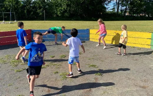 a group of kids playing on a playground