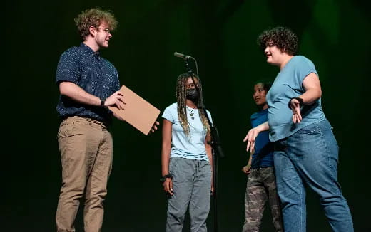 a group of people standing on a stage