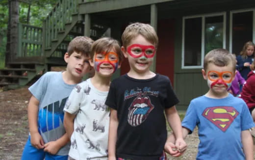 a group of boys with face paint