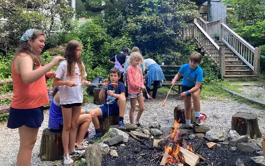 a group of people around a fire