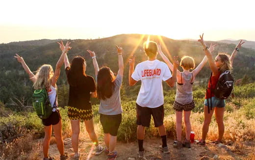 a group of people jumping in the air